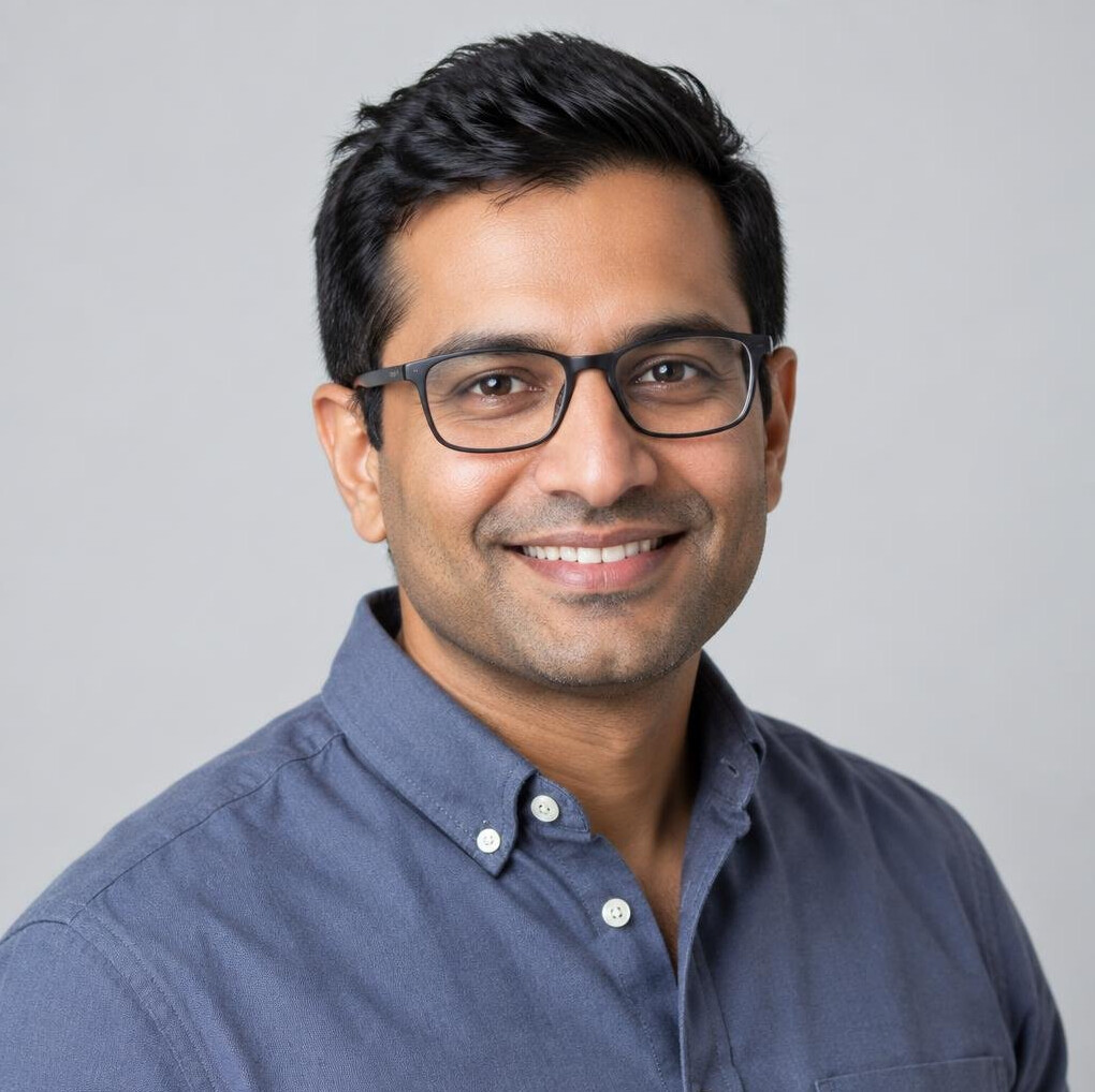 Portrait of a South Asian Norwegian man editing instructor